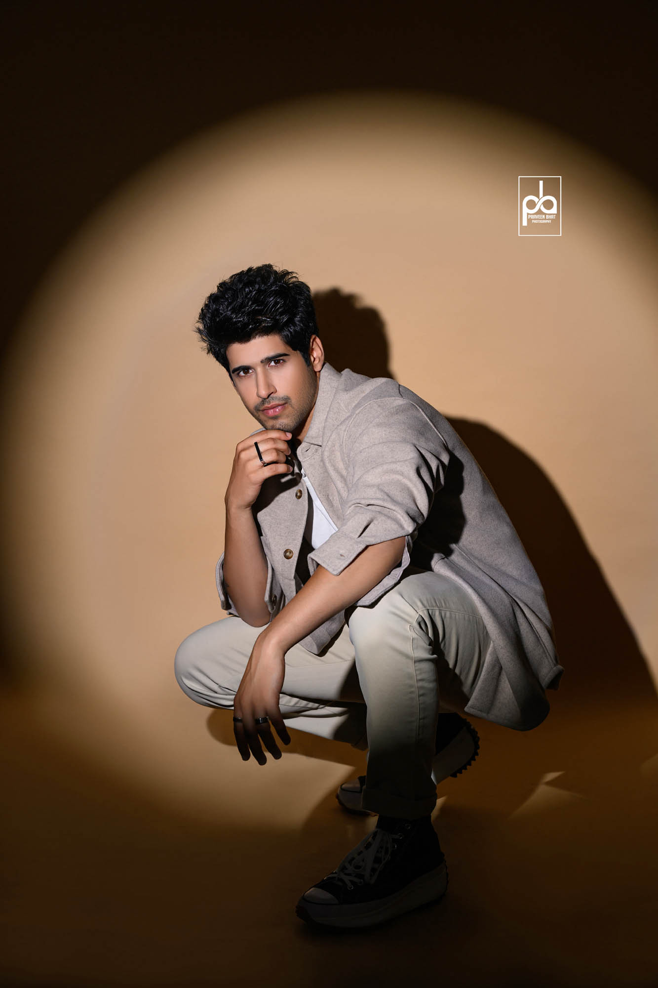 Image of Young Indian Male Model Wearing Suite Posing Over Grunge Wall  Background-HB642318-Picxy